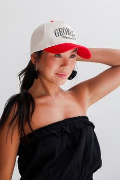 Calling all Dawgs fans, the Red/Black Georgia Tailgating Club Hat was made just for you! This cute hat is made of a soft cotton construction. It has a rounded top and a slightly rounded brim with "Georgia Tailgating Club" embroidered on the front! Adjustable Strap Embroidered 100% Cotton Spot Clean with Damp Cloth or Sponge One Size Fits Most Georgia Tailgate, Fall Flannel, Casual Bodysuit, Brunch Dress, Cute Hat, Exclusive Dress, Rust Dress, Puff Sleeve Dresses, Crop Top Shirts