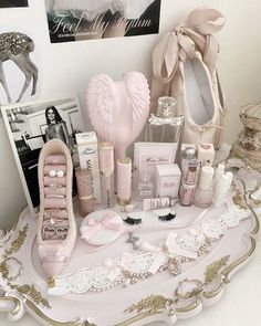 there is a vanity with various items on the table and in front of it are pictures