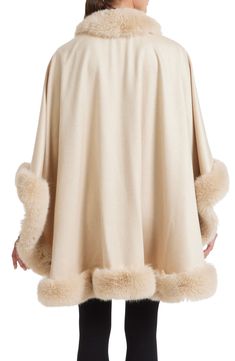 Take the avenue in the refined style of this voluminous cashmere cape finished perfectly with plush faux fur. 32" length (size O/S) Shawl collar Three-quarter sleeves 100% cashmere with 80% polyester, 20% acrylic faux fur Dry clean Made in the USA of imported fabric Fur Trimmed Cape, Cashmere Cape, Refined Style, Shawl Collar, Fur Trim, Three Quarter Sleeves, Quarter Sleeve, Three Quarter, Sofia