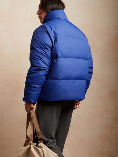 Come rain or snow, this water-repellent puffer holds up under the most inclement weather with cozy recycled down and hands-free straps for the moment temperatures begin to rise.  WARMEST: Fully lined and insulated with 100% recycled 80/20 down fill. Hold Ups, A Storm, Puffer Jacket, Hands Free, Stand Collar, Repellent, Water Repellent, The Heat, Banana Republic