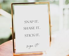 a sign that says snap it, share it, and stick it on a table