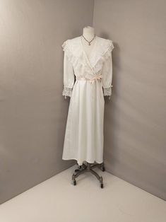 "Beautiful Christian Dior light robe long - mid length, romantic style. Wide lace trim, blush pink ribbon detailing. Inset side pockets Condition is good, with some imperfections. Subtle and scattered pricks to fabric, has been hemmed, replaced belt, some restitching at lace near belt loop. Vintage 90's possibly earlier. Made in USA retains union tag. Quality construction. Washable. Size marked Petite, please go by measurements to determine best fit. Length 51\" Shoulders 15\" Bust to 40\" Waist Spring Feminine Lace Patchwork Nightgown, Feminine Delicate Lace Nightgown, Feminine Lace Patchwork Nightgown, Feminine Cream Nightgown With Lace Trim, Feminine Spring Wedding Nightgown, W Blush, 90s Lingerie, Goth Prom, Green Plaid Shirt