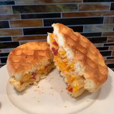 a sandwich cut in half sitting on top of a white plate