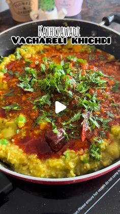 a pan filled with food sitting on top of a stove