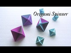 origami spinner on white surface with text overlay that reads organic spinner