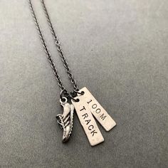 two necklaces with words on them that say,'i love you to the moon and back '