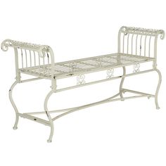 a white metal bench sitting on top of a white floor