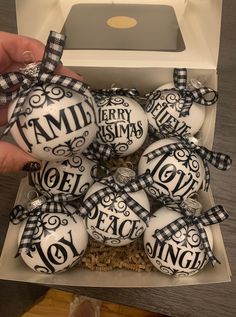 a box filled with white and black ornaments