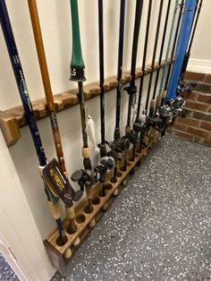 there are many baseball bats lined up on the wall