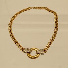 "This sweet flat gold chain necklace is a great addition to any wardrobe. The necklace features clawed clasps studded with faux diamonds. The necklace is in good condition with minimal wear and tear. It weighs 6 oz, being 18\" long and 1/4\" wide. V8707 If you are interested in purchasing more than one item from our shop and/or inquiring about reduced shipping rates--send us your zip code. Also, please contact us for International shipping rates." Gold Chain Link Necklace With Diamond Accents, Formal Rhinestone Necklace With Metal Chain, Gold Chain Necklace With Diamond Accents, Vintage Round Curb Chain Necklace, Gold Rhinestone Necklace With Chain For Formal Occasions, Elegant Gold Rhinestone Chain Link Necklace, Formal Gold Rhinestone Necklace With Adjustable Chain, Gold Round Rhinestone Costume Necklace, Formal Adjustable Chain Necklace