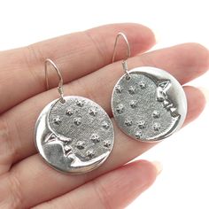 Great vintage condition.  925 Sterling Silver Vintage Man in The Moon Dangling Earrings  Weight: 10.2g   WELCOME TO PAWN SHOP We are an actual pawn shop and have been in business for over 25 years. Since 1990, our establishment has been serving a variety of clients by providing them with short term cash solutions and options of liquidity regarding their treasured heirlooms. Acknowledging that today′s customers are very sophisticated and are looking for a variety of investments, our acquisitions Vintage Sterling Silver Moon Jewelry, Vintage Moon Shaped Sterling Silver Jewelry, Vintage Moon-shaped Sterling Silver Jewelry, Sterling Silver Celestial Earrings For Gift, Round Earrings With Moon Charm For Anniversary, Vintage Crescent Moon Charm Earrings, Sterling Silver Celestial Earrings With Moon Charm, Celestial Sterling Silver Round Earrings, Nickel-free Moon Shaped Jewelry For Anniversary