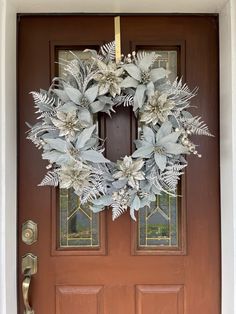 a wreath is hanging on the front door