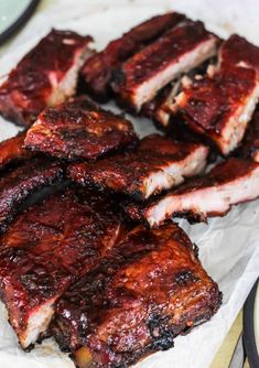 barbecue ribs are piled on top of each other