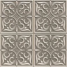 an image of decorative tin tiles in silver color with swirls and scrolls on them