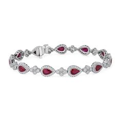 Pear shaped rubies chase diamonds around your wrist with this exuberant bracelet. It's made with 18k white gold that's highly polished for a shining finish. Necklaces Blue, Crafted Jewelry, Blue Nile, Loose Diamonds, Pear Shaped, Pandora Charm Bracelet, Diamond Bracelet, Pear, Ruby