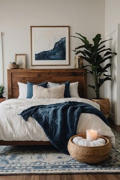 a bedroom with a bed, rug and plant in the corner on the floor next to it