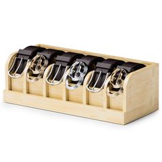 a wooden holder with six pairs of knives in it and four holders on each side