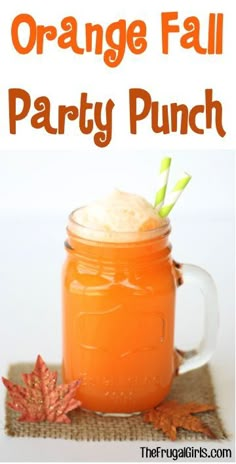 an orange party punch in a mason jar with pine cones on the side and text overlay