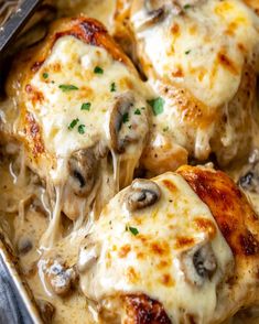 chicken covered in cheese and mushrooms in a casserole dish