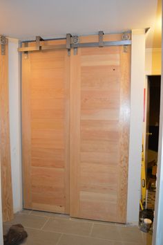 two wooden sliding doors in a room