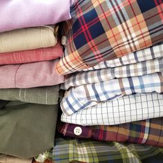 a pile of folded shirts sitting next to each other