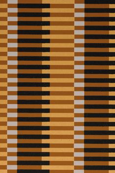 an orange and black striped rug with vertical stripes on the bottom, in different colors