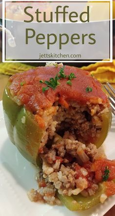 stuffed peppers on a white plate with a fork in the middle and text overlay that reads stuffed peppers