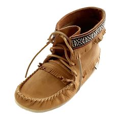 Description Details Sizing Moose Hide Product Video These men's moccasin boots are very stylish and comfortable while keeping a classic and authentic Native Indian look. They are ankle-high and feature a Native American style braid around the top. They are decorated with fringes around the ankle, heel and vamp. These men's moccasin boots have rawhide leather laces for tightening and they are handmade from high-quality genuine moose hide leather in a cork tan color. These men's moccasin boots are Mens Moccasins Boots, Mens Leather Moccasins, Mens Fringe, Native American Moccasins, Winter Style Guide, Moccasin Pattern, Native American Clothing, Warm Winter Boots, Moccasins Mens