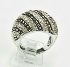 "CLASSIC DOME RING HAS ROWS OF BRILLIANT CUT CZ'S ALTERNATING WITH A ANTIQUED BEADED SILVER DESIGN OUTLINED BY GOLD OVER SILVER BORDER. THE BRIGHTLY POLISHED SILVER MOUNTING ACCENTED WITH THE ANTIQUED BLACK AND CLEAR CZ'S REALLY SETS THIS RING OFF. HEAVY STERLING MOUNTING WITH INCREDIBLE CRAFTSMANSHIP.  TOP OF RING MEASURES APPROX 5/8\" x 1\".  STERLING SILVER  SIZE 8. Wonderful Condition!!  See the enlarged pictures. HALLMARKED 925" Domed Ring, Diamond Cluster Ring, Onyx Stone, Hinged Bangle, Diamond Cluster, Cluster Ring, Tri Color, Rings Statement, Vintage Rings