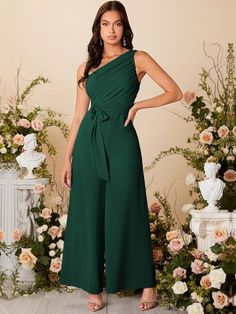 Dressing for Success: Classy Graduation Outfit Ideas for High School and University Celebrations in 2023 One Shoulder Jumpsuit Outfit, Green Jumpsuit Outfit Wedding, Jumpsuit For Wedding Guest Classy, Wedding Guest Jumpsuit Summer, Formal Jumpsuits For Women Wedding, Graduation Outfits For Mothers, Green Jumpsuit Outfit, Dark Green Jumpsuit, Jumpsuit Outfit Wedding