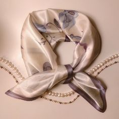 Discover timeless elegance with our exquisite silk scarf from Silquora. Handmade from high-quality silk, this scarf combines luxury and style at the highest level. A must-have accessory for every occasion. Our Silquora silk scarf is more than just an accessory - it's a statement of sophistication and taste. Each scarf is carefully handcrafted from the finest silk, creating a luxurious texture and silky sheen. From elegant evening events to casual outings on the town, this scarf will add unparall Elegant Spring Square Silk Scarf, Elegant White Square Scarf, White Square Silk Scarf As Gift, Elegant White Square Silk Scarf, Elegant Silk Square Scarves, Luxury Square Silk Scarf For Formal Events, Luxury Square Silk Scarf For Formal Occasions, White Square Silk Scarf For Spring, Elegant Square Scarves For Formal Occasions