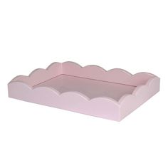 a pink paper tray with scalloped edges on a white background for display purposes