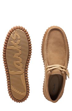 A rib-debossed bumper sole adds rugged detail to a supple suede boot that takes after the iconic Wallabee style with heritage details like skilful topstitching. Removable, cushioned insole with arch support Leather upper and lining/rubber sole Imported Rugged Suede Sneakers With Rubber Sole, Casual Suede Moc Toe Boots, Suede Sneakers With Textured Sole And Moc Toe, Rugged Suede Sneakers With Plain Toe, Suede Moc Toe Sneakers For Walking, Casual Moc Toe Boots With Textured Sole, Suede Boots With Textured Sole For Walking, Casual Suede Boots With Stitched Sole, Clarks Wallabees Men Outfit