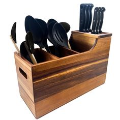 a wooden knife holder with knives and spoons in it on a white background,