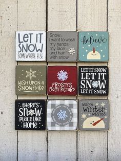 six magnets with different sayings on them sitting on a wooden surface in front of a wall