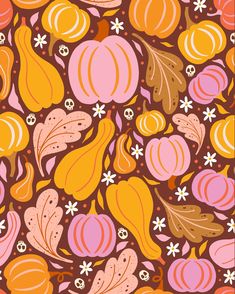 an orange, pink and brown pattern with leaves and flowers on it's surface