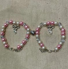 Coquette pink and white bow matching bracelets.  Beads are made out of glass and faux pearl beads, with a silver plated bow and heart charms.  Lobster clasp and chain extender are both nickle-free and silver plated. All my jewelry is handmade and should please be handled with care. ❤️ Bracelets Beads, Coquette Pink, Chain Extenders, White Bow, Matching Bracelets, Pink And White, Pearl Beads, Heart Charm, Faux Pearl