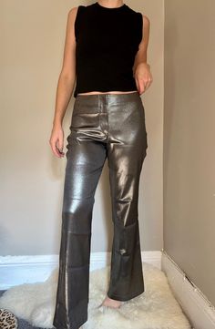 "Wow! Super cool party pants. Shiny silver, mid/high rise with a straight/wide leg. Label: None, made in Canada Material: 97% Polyester, 3% Spandex Condition: Great! some age appropriate wear but nothing to note Size: listed as 11, estimated Medium/Large. has stretch. Waist: 16\" Rise: 11\" Hip: 40\" Inseam: 31.5\"" 60s Maxi Dress, Goth Baddie, Opera Coat, Party Pants, Maxi Coat, Shiny Silver, Trousers Women, Leather Pants, Capri Pants