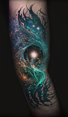 an artistic tattoo design on the leg, with blue and green swirls around it