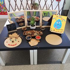 the table is set up with various items for children's arts and crafting