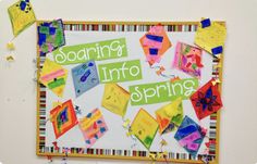 a bulletin board that has some pictures on it with the words soaring into spring written in green