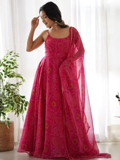 Introducing our stunning "pretty pink bandhani printed chiffon festival wear gown with dupatta" - a must-have for your festive wardrobe! This beautiful pink color gown features intricate bandhani print work, adding a touch of traditional charm. The chiffon fabric adds a touch of elegance, making it perfect for festivals, functions, and special events.
The matching chiffon dupatta with bandhani print work and fancy lace border work completes the look, giving you a coordinated and stylish outfit. Anarkali Kurtis, Pink Anarkali, Kurtis For Women, Printed Anarkali, Bandhani Dress, Gown With Dupatta, Full Length Gowns, Pure Chiffon, Pink Gowns