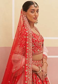 Capture the essence of eternal beauty with this Red Silk Embroidered Bridal Lehenga. Crafted from luxurious raw silk, it features intricate zardozi embellishments that combine silken threads, dabka, cutdana, and sequins. The meticulously embroidered blouse and matching double dupatta in red and blush pink hues complete this enchanting ensemble. Perfect for a bride looking for a timeless and captivating wedding dress. Composition : Lehenga and Blouse - Raw Silk, Dupatta - Soft Net Care: Dry Clean Red Dola Silk Sets With Sheer Dupatta, Red Art Silk Set With Sheer Dupatta, Red Dola Silk Choli With Sheer Dupatta, Red Lehenga With Sheer Dupatta In Art Silk, Red Dola Silk Lehenga With Sheer Dupatta, Red Choli With Sheer Dupatta For Traditional Ceremonies, Red Lehenga With Unstitched Blouse In Dola Silk, Red Lehenga With Unstitched Blouse And Traditional Drape, Red Dola Silk Sets With Unstitched Blouse