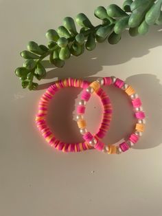 2 gorgeous orange and pink bracelets Pink Bohemian Bracelets For Spring, Colorful Beads Coral Bracelet For Beach, Beach Bracelets With Colorful Beads In Coral, Vibrant Handmade Bracelets For Beach, Coral Round Beaded Bracelets For Beach, Coral Bracelets With Colorful Beads For Beach, Coral Round Beads Bracelets For Beach, Coral Round Beads Bracelet For Beach, Pink Friendship Bracelets For Summer