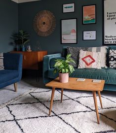 a living room with two couches and a coffee table in front of the wall