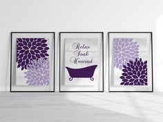 three framed pictures with purple flowers on them in a white room, one has a bathtub and the other is a bathroom