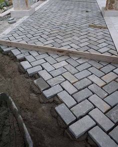 an old brick walkway in the middle of a yard