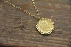 Check out this item in my Etsy shop https://www.etsy.com/il-en/listing/483600689/gold-coin-necklace-coin-necklace-gold Antique Gold Coin Pendant Medallion Necklace, Vintage Brass Coin Necklace With Coin Pendant, Gold Medallion Coin Necklace In Brass, Antique Gold Brass Medallion Necklace With Coin Pendant, Brass Coin Medallion Necklace, Gold Brass Medallion Coin Necklace, Vintage Brass Coin Pendant Necklace, Brass Medallion Coin Necklace, Vintage Gold Coin Brass Necklace