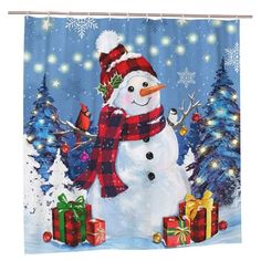 a shower curtain with a snowman and presents in front of christmas trees on a snowy day