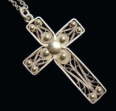 "Lovely antique Victorian handcrafted silver cross pendant with wonderful miniature filigree work that reminds of stylized sunflowers. Comes with vintage matching sterling silver chain. Great gift to your loved one , that you may pass from generation to generation. Date: c.1890 Mark: none Condition: Excellent. Ready to wear and enjoy Material: cross tests as silver approx. 800~850, chain tests as sterling silver /approx. 925 (all carefully acid tested) Size: cross is 2\" x 1,1/8\"( 50 mm x 30 mm Heart Shape Box, Silver Cross Pendant, Pretty Rings, Silver Cross, Silver Filigree, Silver Man, Cross Pendant, Sterling Silver Chains, Antique Silver